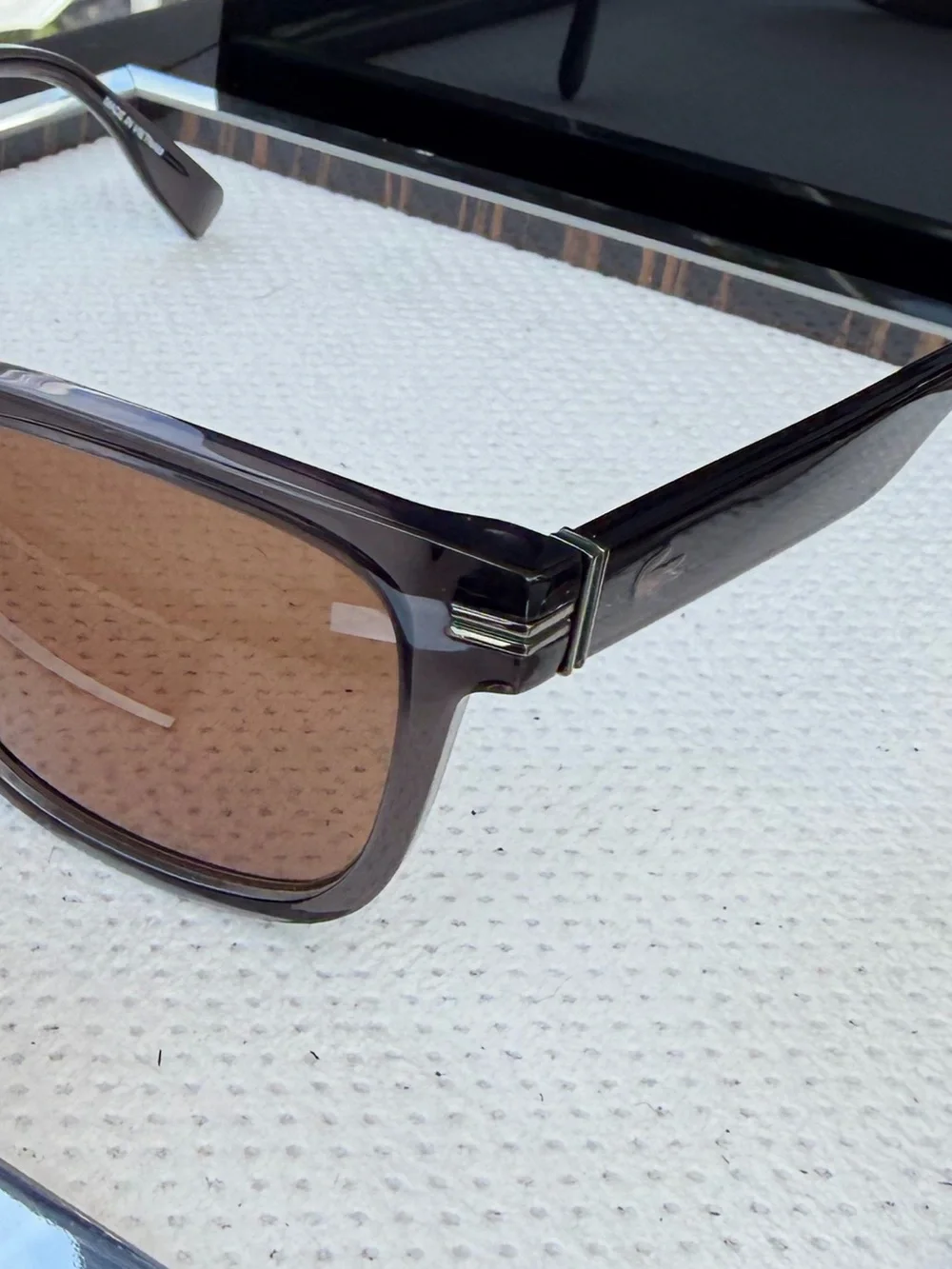 Lacoste Men’s Smoke Transparent Frame Sunglasses with Brown Lenses